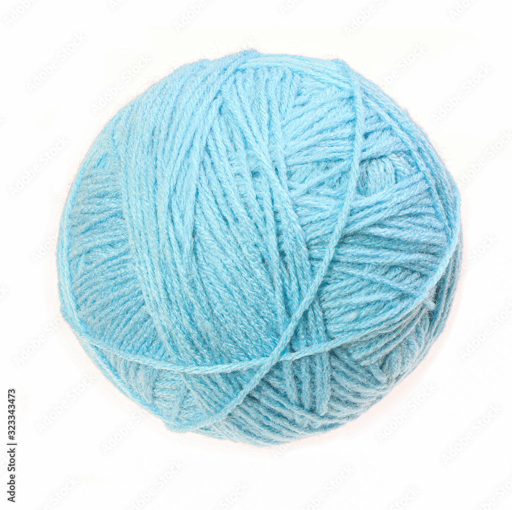 Clew of woolen thread isolated on a white background. Blue ball of woolen. Clew of woolen thread isolated on a white background. Blue ball of woolen.