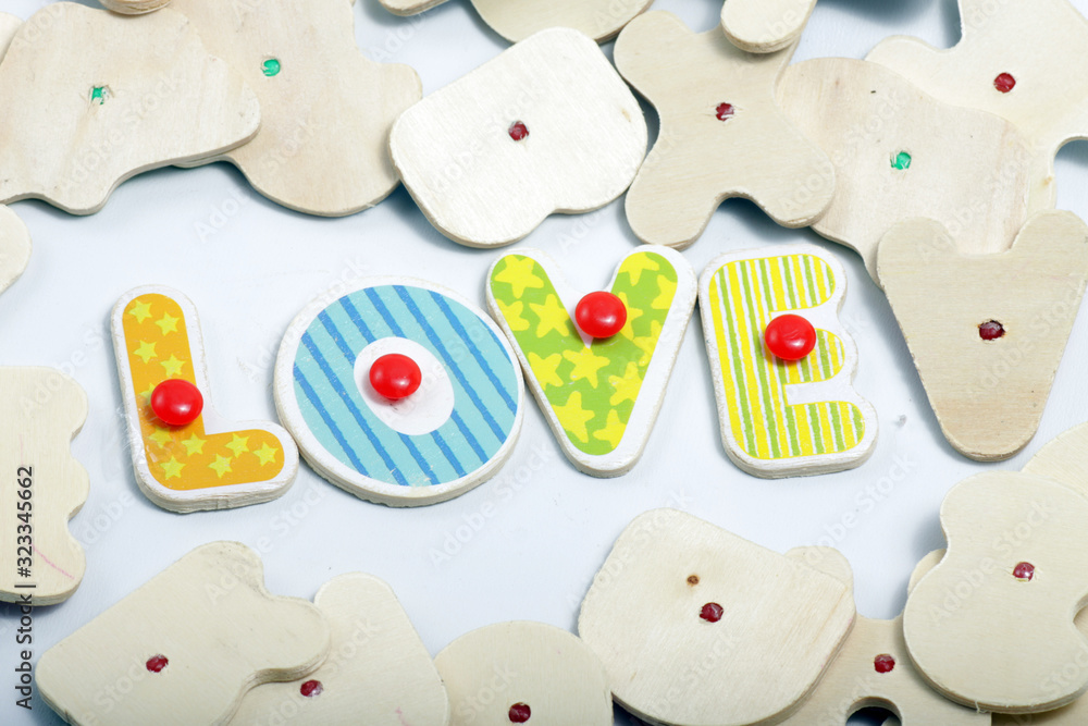 wooden letter that can make some words such as, win, love, mix wooden letter that can make some words such as, win, love, mix
