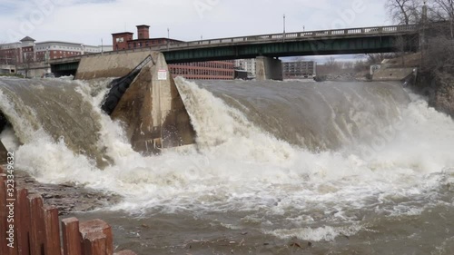 Torrential waterfall pours over Winooski River Dam, Winooski, Vermont photo