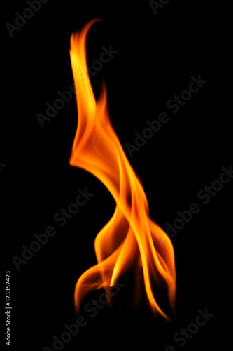 Fire and burning flame of candle light isolated on dark background for graphic design 