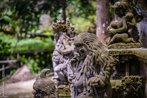 Balinese sculptures and traditional architectural details in a temple near Ubud, Bali, Indonesia © Huntergol