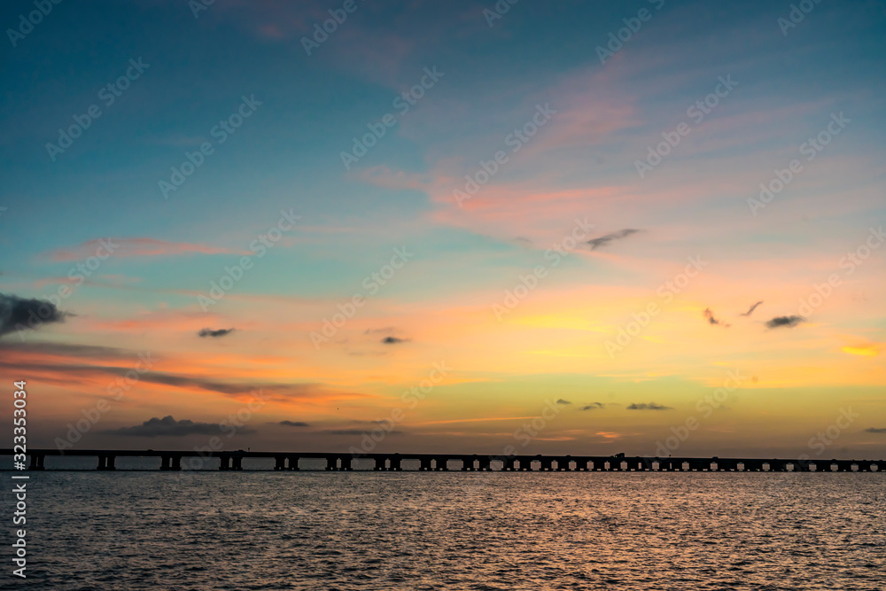 The sun sets behind a bridge in Florida The sun sets behind a bridge in Florida