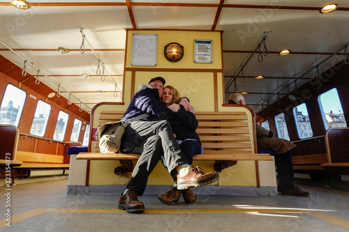 Stockholm, Sweden A couple hugging aboard the Djurgårdsfärjan (Djurgården ferry)