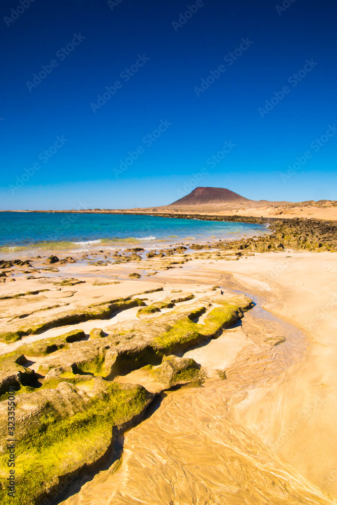 Beautiful landscape view on La Graciosa Island coastline, on the walking path from Caleta del Sebo to Montana Amarilla volcano. Popular tour from Orzola - Lanzarote, Spain