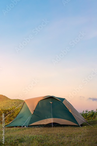 Camping tent of tourist with beautiful sky in sunrise, Selective focus.