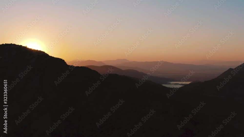 Beautiful view of sunrise over mountain top at sea, Turkey, Greece, Mediterranean sea Beautiful view of sunrise over mountain top at sea, Turkey, Greece, Mediterranean sea