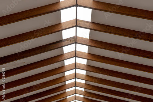 The inner roof consists of wooden beams and lets natural light through in the middle