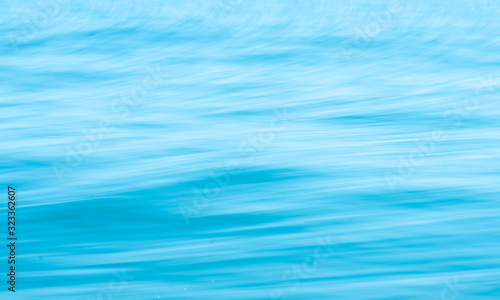 Smooth surface wave in ocean Use techniques panning and low shutter speeds