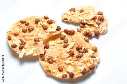 Thai snack-fried peanut with wild yam on the isolated white background