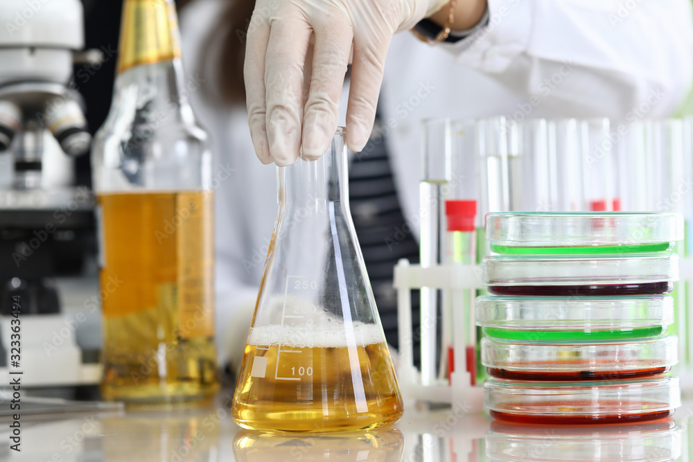 Oil sample, chemical experience in laboratory. Test tubes and trial amount oil are on table. Experiment research oil quality in laboratory. Chemical composition technology test material. Oil sample, chemical experience in laboratory. Test tubes and trial amount oil are on table. Experiment research oil quality in laboratory. Chemical composition technology test material.