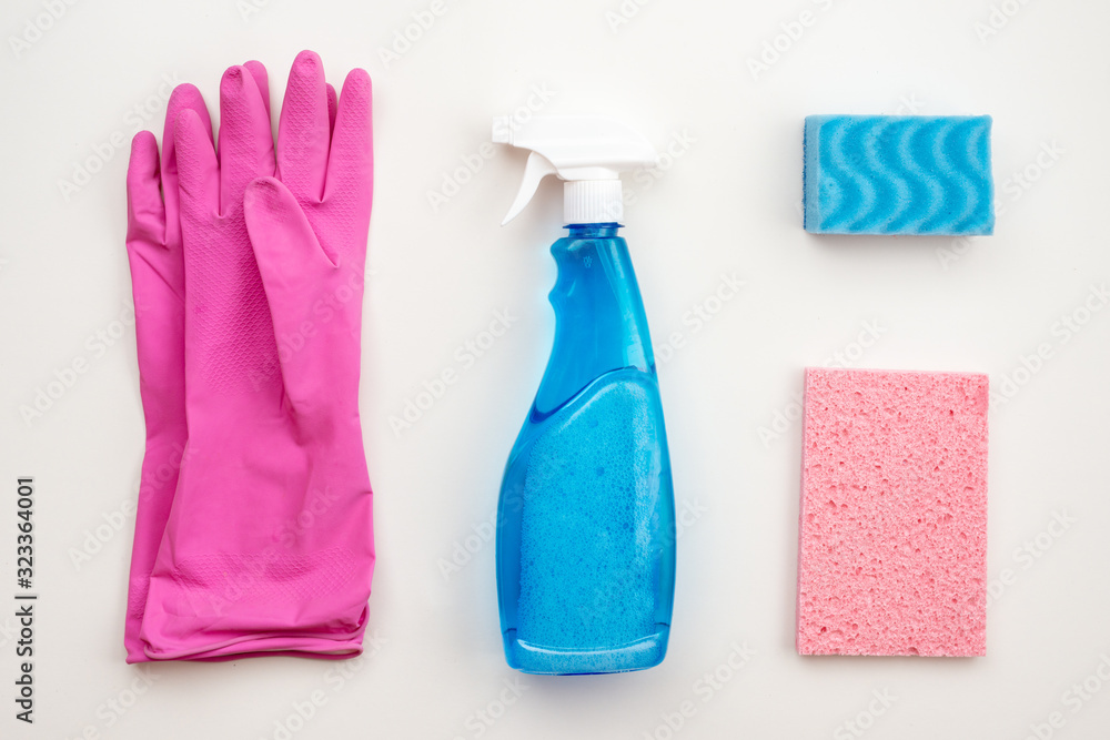Latex, pink gloves, cleaning brush, spray, washcloth, cloth on a white background. Latex, pink gloves, cleaning brush, spray, washcloth, cloth on a white background.