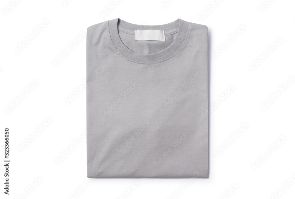 Grey folded t-shirt isolated on white background with clipping path. Grey folded t-shirt isolated on white background with clipping path.