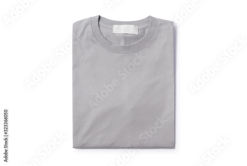 Grey folded t-shirt isolated on white background with clipping path.
