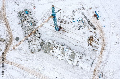 aerial top view of new city residential area under construction at winter time