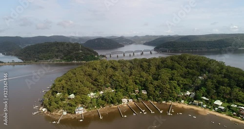 Waterfront of small rocky Dangar island on Hawkesbury river near Brooklyn and railway line to Central coast. photo