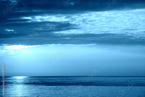 Sunrise over the sea near the coast of Sicily  Italy. Natural bakground blue color toned