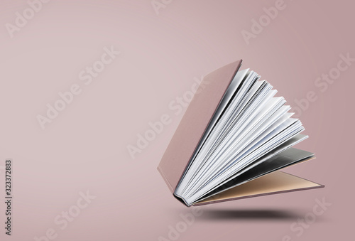 Large hardcover book with open pages