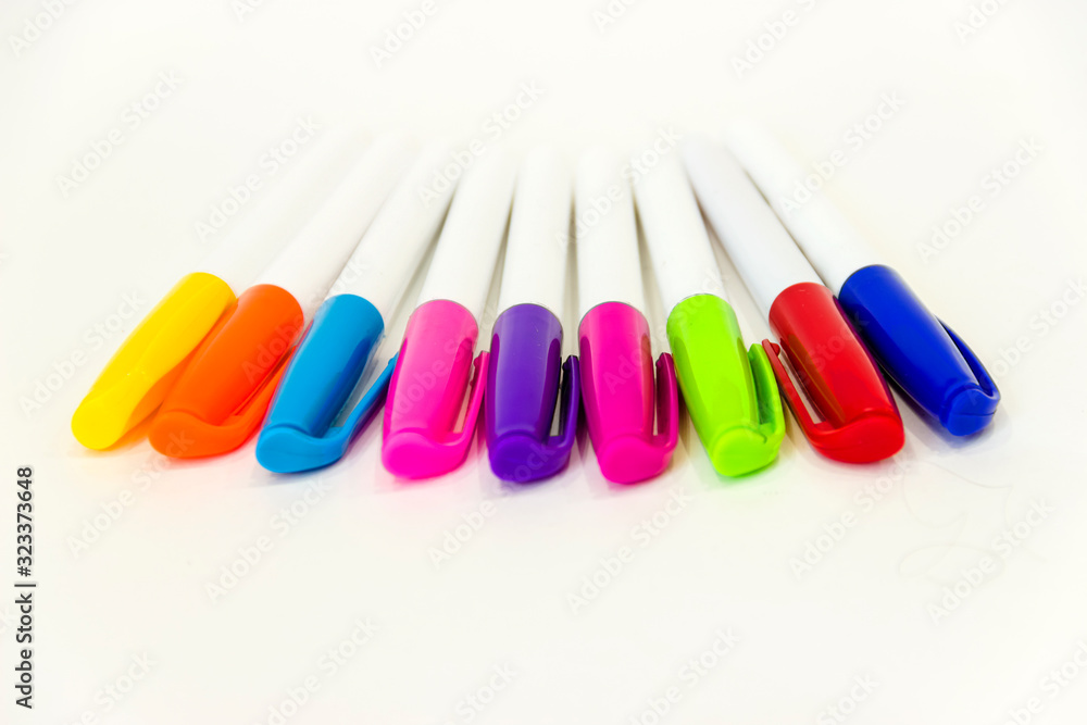 multicolored felt-tip pens on a white background multicolored felt-tip pens on a white background
