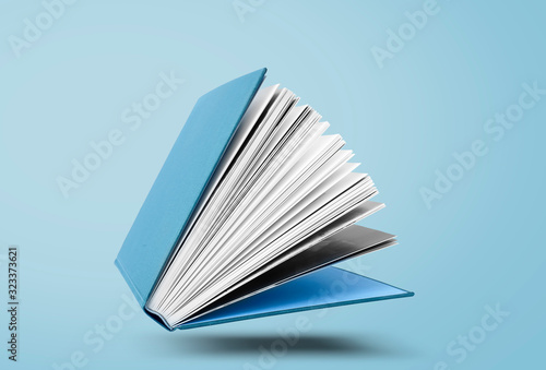 Large hardcover book with open pages photo