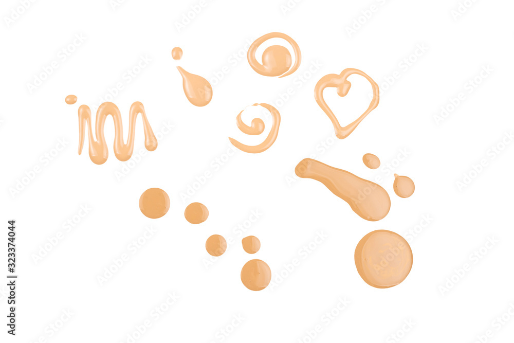 Obraz premium Liquid foundation swatch isolated on white background. Close Up of makeup cream sample.
