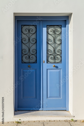 Old wooden door of an mediterranean house, vintage background.