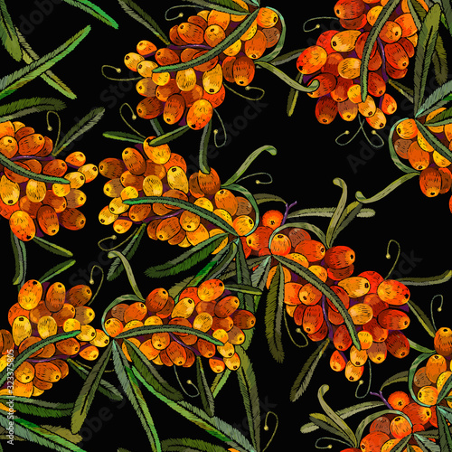 Sea buckthorn berries branch. Seamless pattern. Embroidery design. Fashion template for design of clothes, tapestry. Autumn garden art