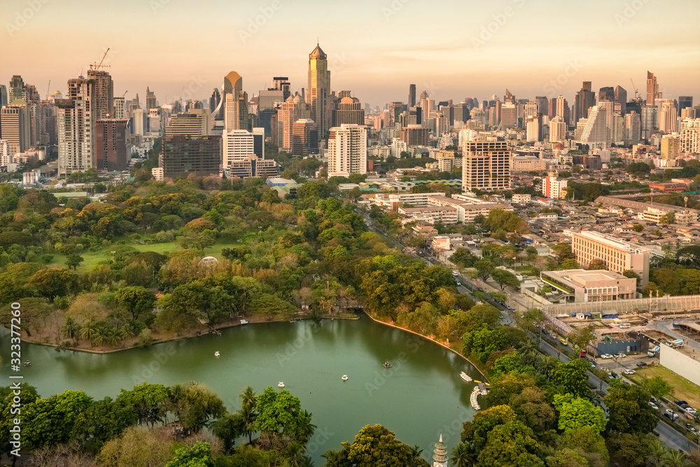 Bangkok city skyline with Lumpini park and urban skyscrapers at sunset Bangkok city skyline with Lumpini park and urban skyscrapers at sunset
