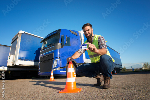 Truck driving school and CDL training. Driver candidate successfully finished truck driving training and acquired commercial driving license. photo