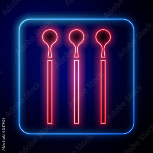 Glowing neon Matches icon isolated on blue background.  Vector Illustration