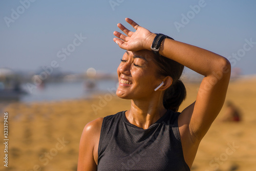 Schilderij op canvas portrait of young attractive and sweaty happy Asian Indonesian woman in her 40s