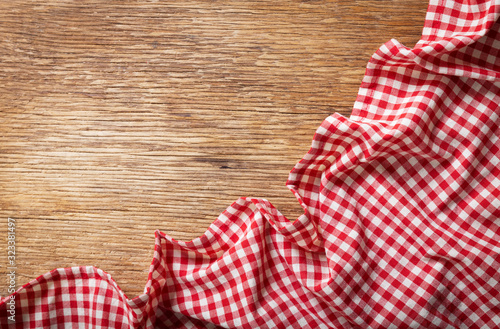 red checkered tablecloth on a wooden table