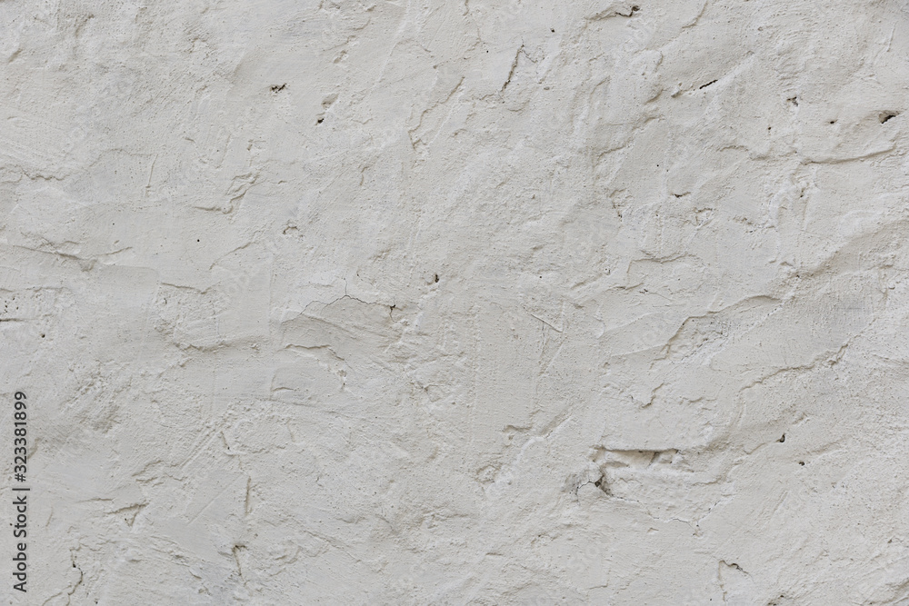 Fototapeta premium White rough concrete wall texture background. cement wall. plaster texture. blank for the designer