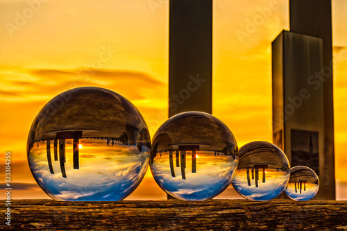 Four glass balls at sunset photo