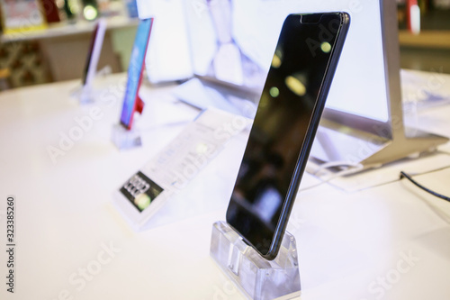 New mobile smartphone in telecommunication electronic store display showcase