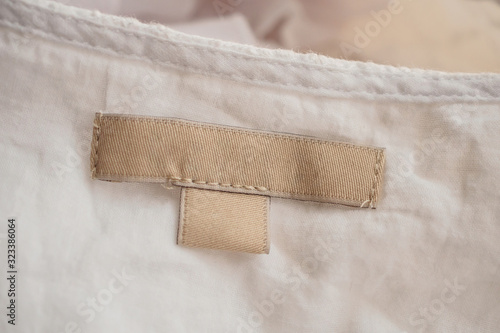 blank clothing label on fabric texture background