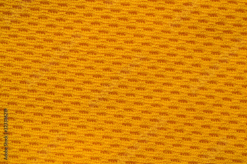 Orange color sports clothing fabric jersey football shirt texture top view