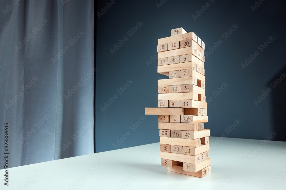 Column game jenga. The concept of a mortgage, investment risks, economic crisis, economic instability. Column game jenga. The concept of a mortgage, investment risks, economic crisis, economic instability.
