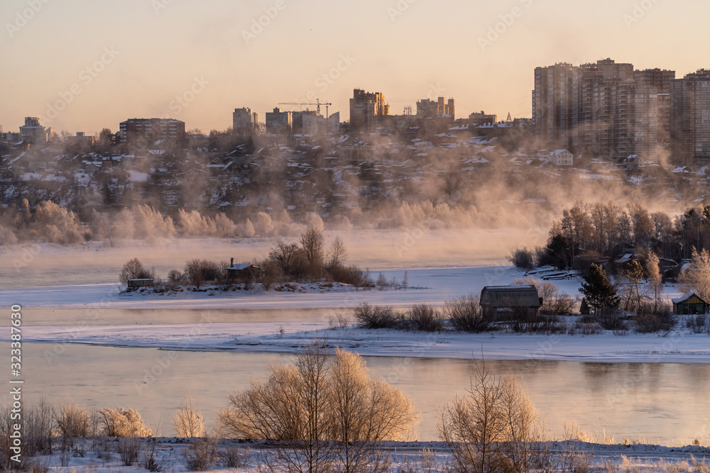 Morning fog on the Angara river, view from the heights