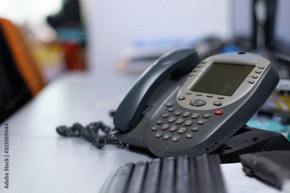 Selective focus Analog phone place on desk office ,phone for comunication,Bussiness and finance Selective focus Analog phone place on desk office ,phone for comunication,Bussiness and finance
