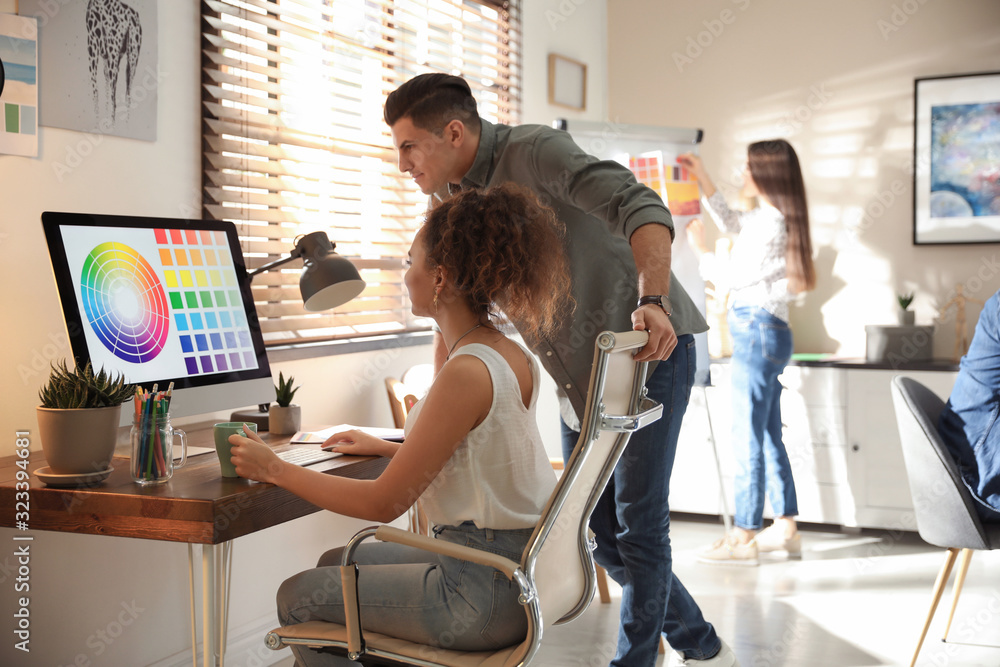 Team of professional designers working in office Team of professional designers working in office