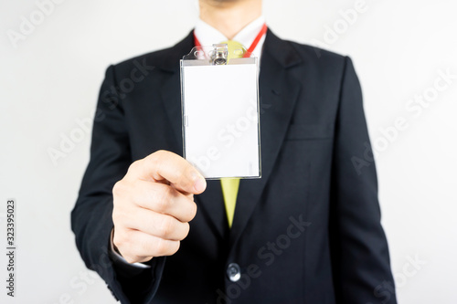 Man holding Identification card.