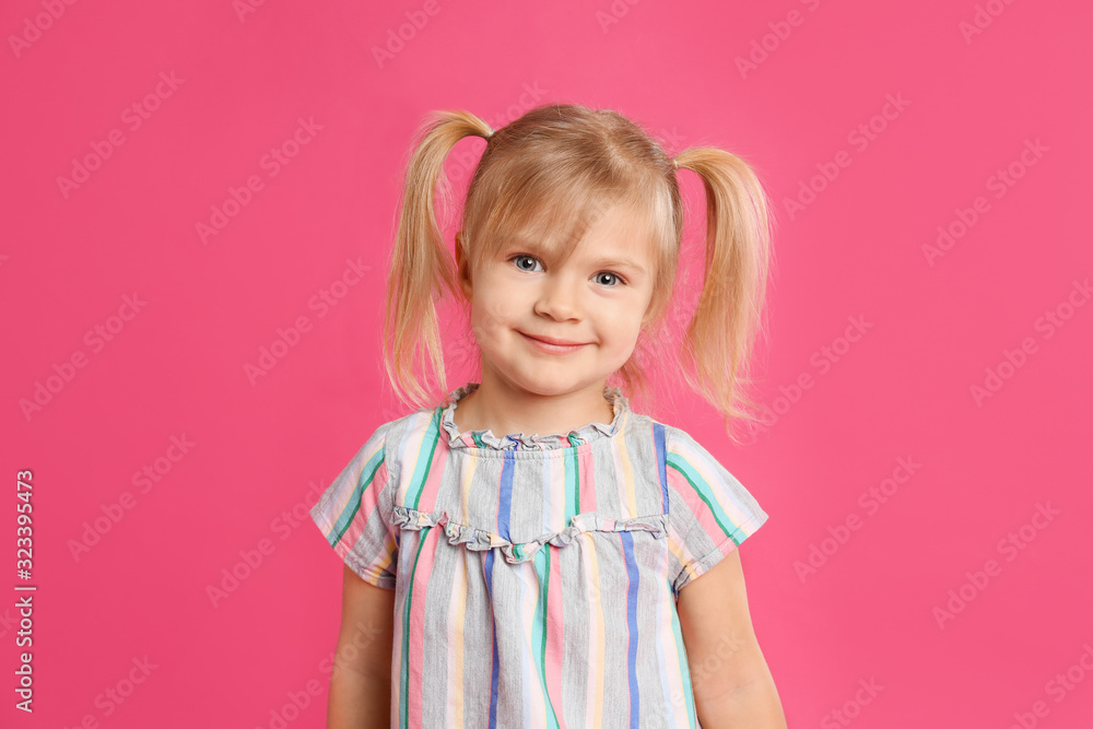 Portrait of cute little girl on pink background Portrait of cute little girl on pink background