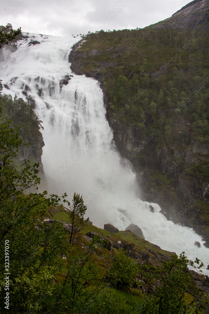 Stunning waterfall in Husedalen valley in Hardangervidda national park, Norway