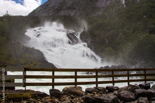 Stunning waterfall in Husedalen valley in Hardangervidda national park,  photo