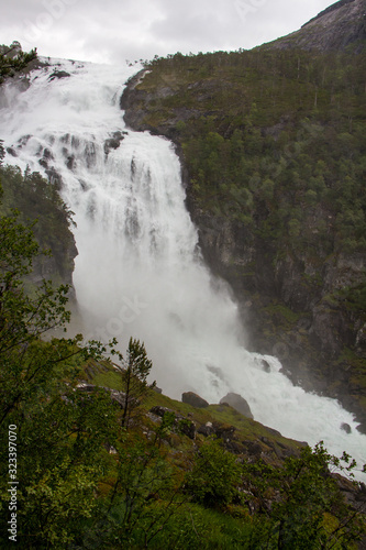 Stunning waterfall in Husedalen valley in Hardangervidda national park  Norway