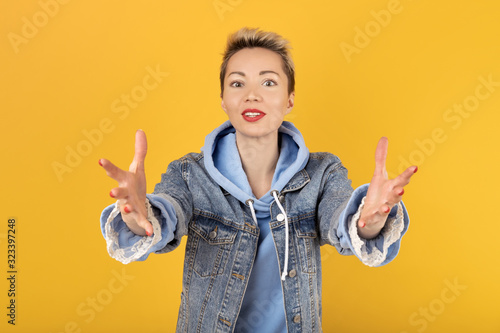 haphappy European girl with excessive energy close-up with a very happy expression on her face,pulls her hands and asks to give her a gift. She is delighted with what she saw and wants to get a gift photo