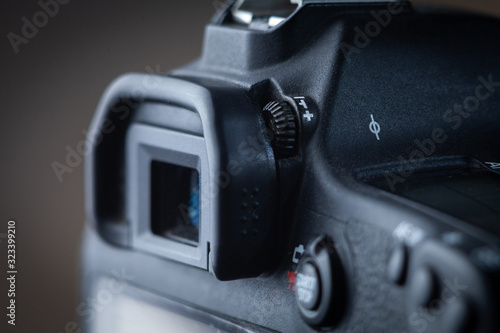 Close-up macro shot of viewfinder of the modern digital SLR camera. Ring of  diopter adjustment. photo