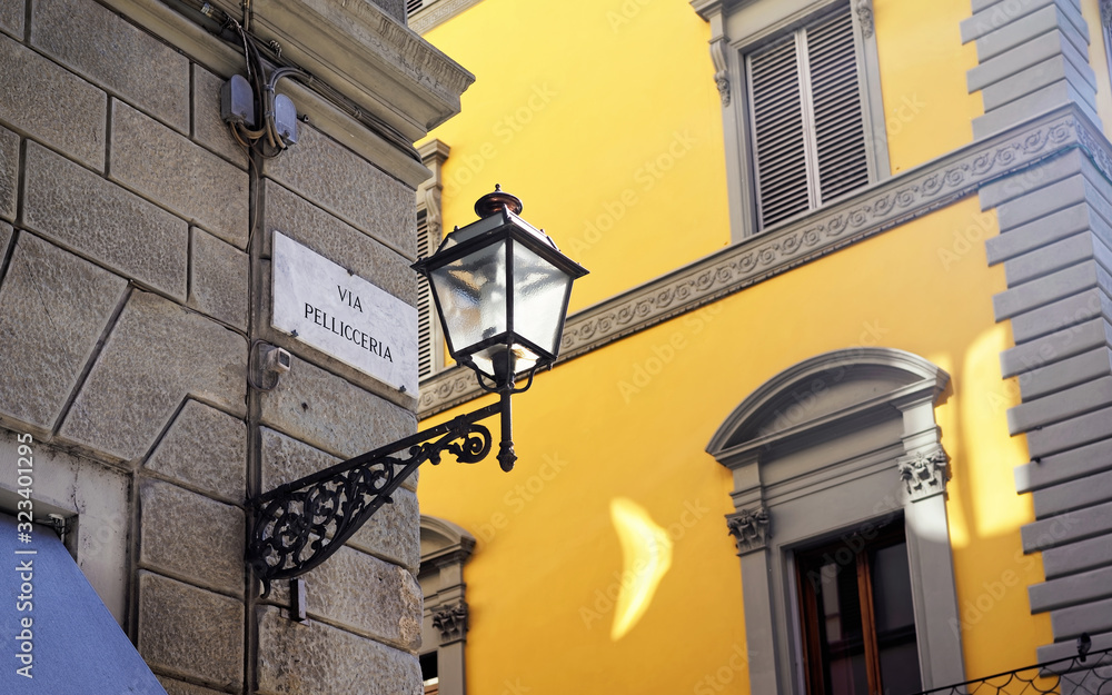 Via Pelliceria Street sign on wall in Florence