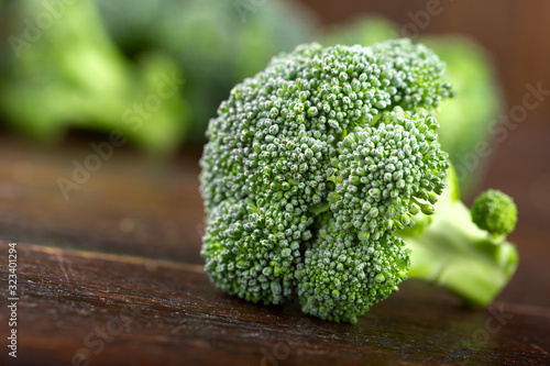 Fresh broccoli on the table surface.