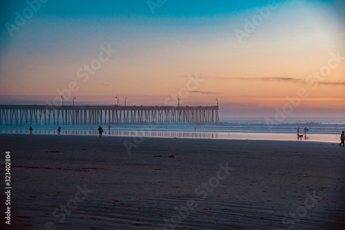 Fototapeta Naklejka Na Ścianę i Meble -  sunset over the wooden pier of Pismo Beach California